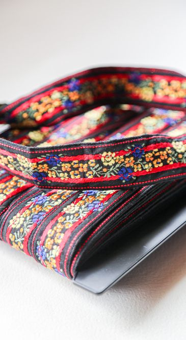 Hovedbilde Blomsterbånd gul-orange/blå blomster 35mm